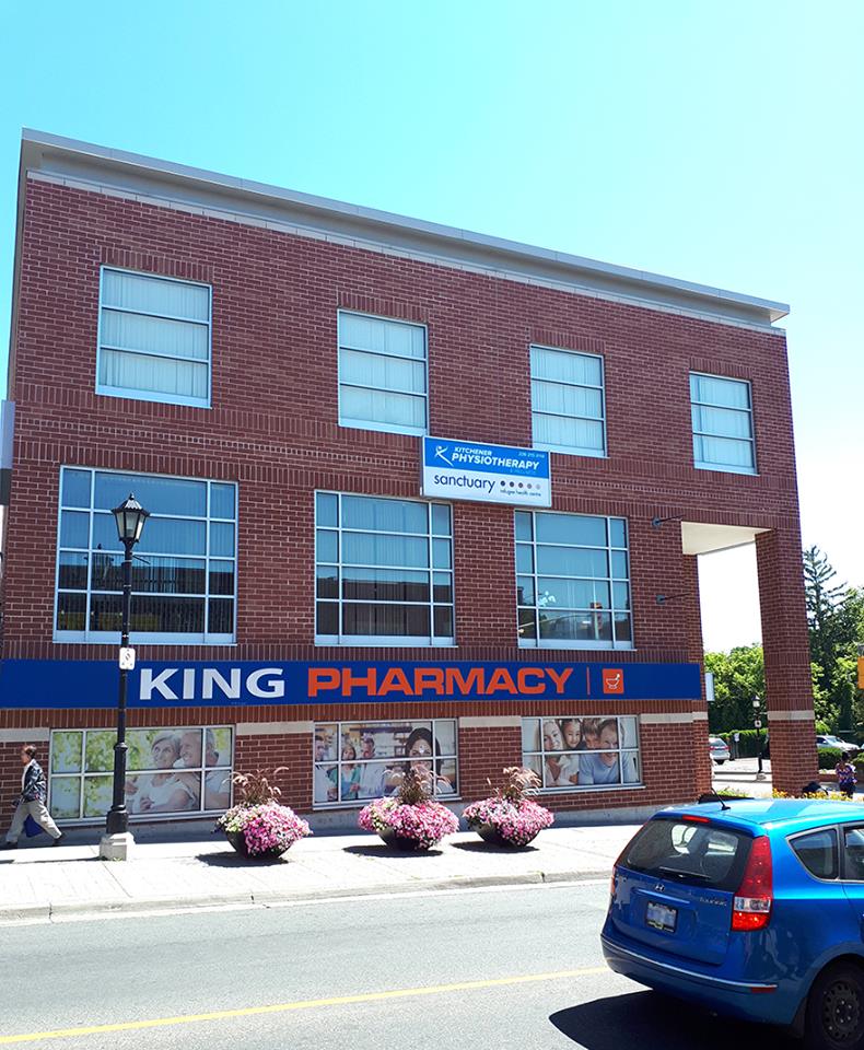 The King Street East building, the clinic's sign above the King Pharmacy storefront
