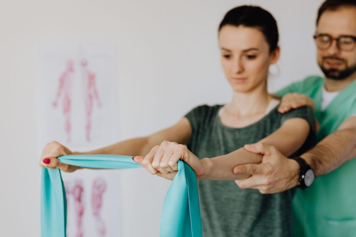 A supported resistance band exercise for the shoulder and elbow